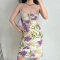 Model slight side pose purple iris floral midi slip dress square neck front tie bodycon midi dress