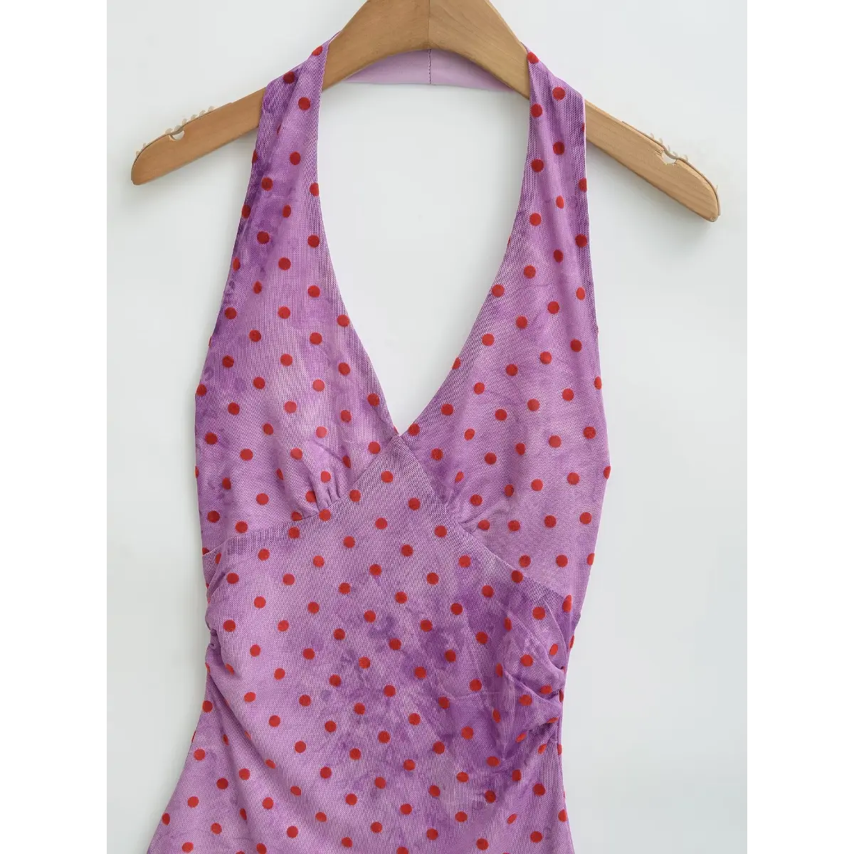 Full front view of the purple halter dress with red polka dots, featuring the matching long scarf tie.