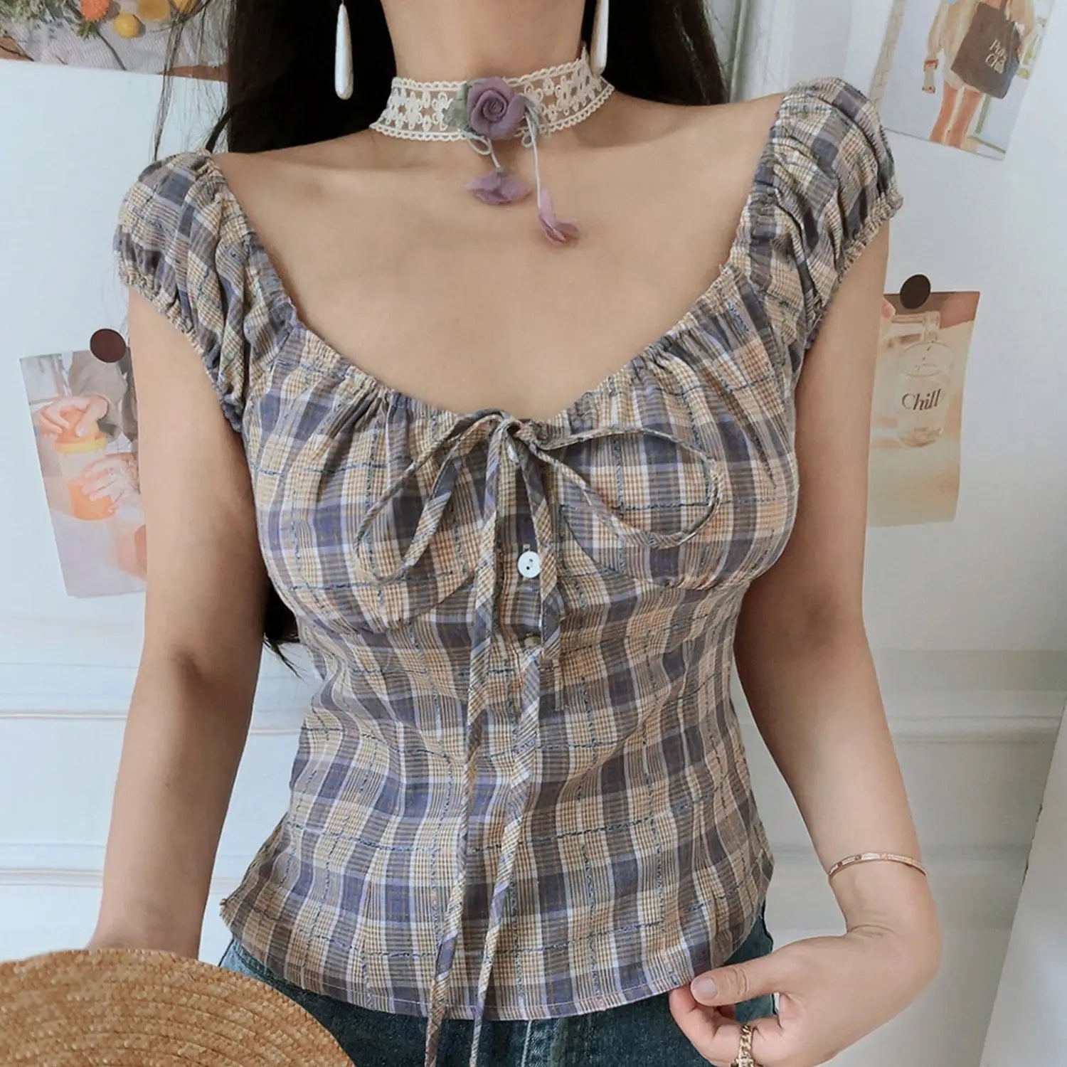 Women vintage purple tan plaid crop top, ruched square neck button front drawstring detail, model paired with denim jeans indoor shot
