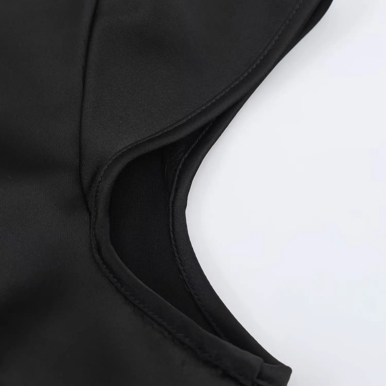 Cap sleeve hem close-up, folded serged edge stitching, double layer satin lining inside armhole