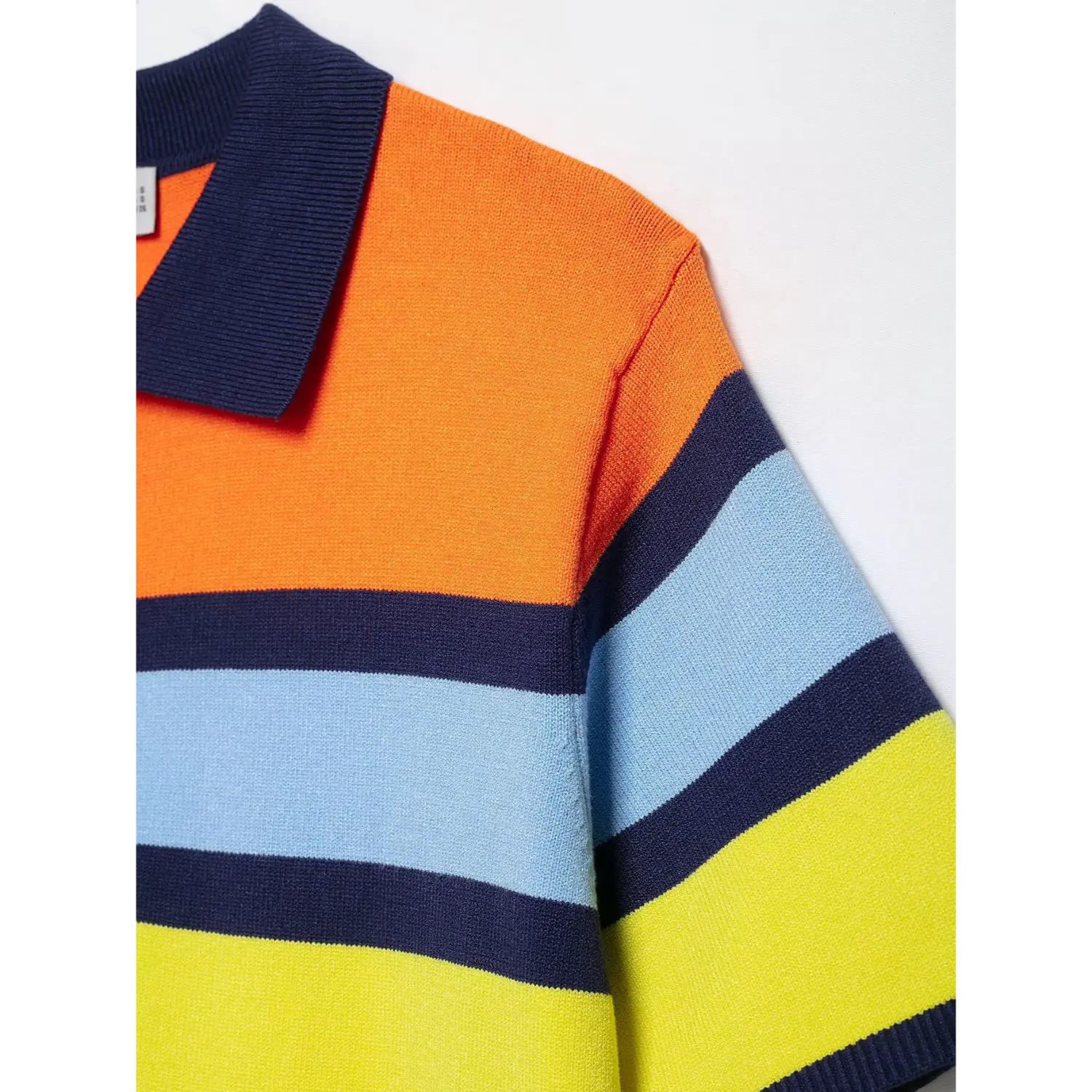 Bottom hem overview, solid navy rib knit binding, double orange thin stripe block above navy hem band, lightweight knit fabric