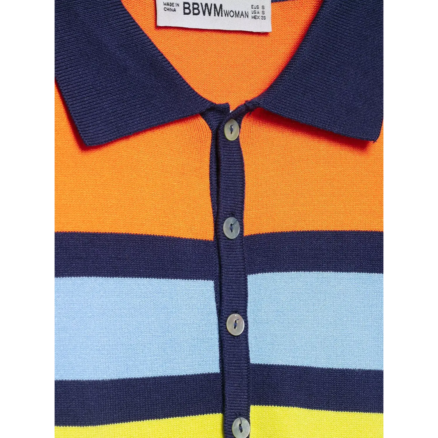 Short sleeve cuff closeup, solid navy ribbed hem cuff, multi-color stripe knit sleeve body, fine tight knit stitches