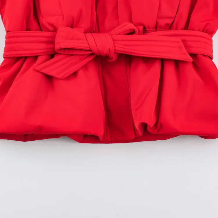 Close-up of self belt and tied waist