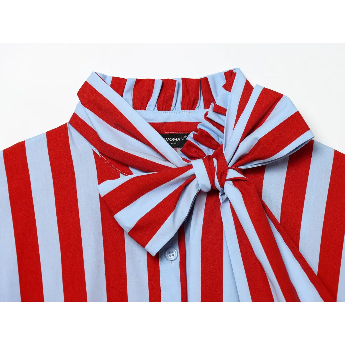 Close-up of the top's ruffled neckline, large striped bow, and button placket.
