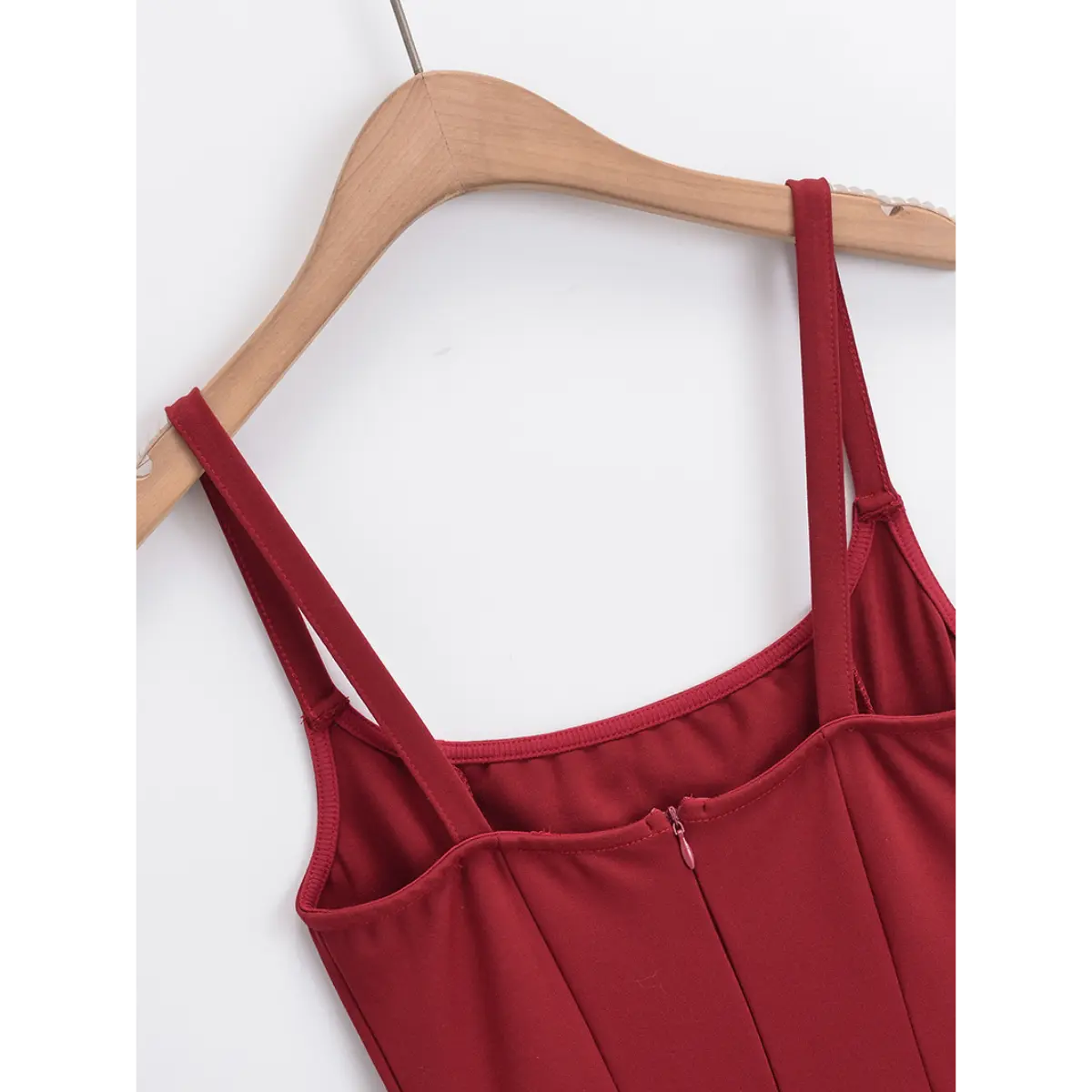 Back view of the red cami dress, showing the hidden zipper and double strap detail
