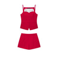 Full flat‑lay matching two‑piece set, red spaghetti strap cami top and high waist tailored suit shorts, white background