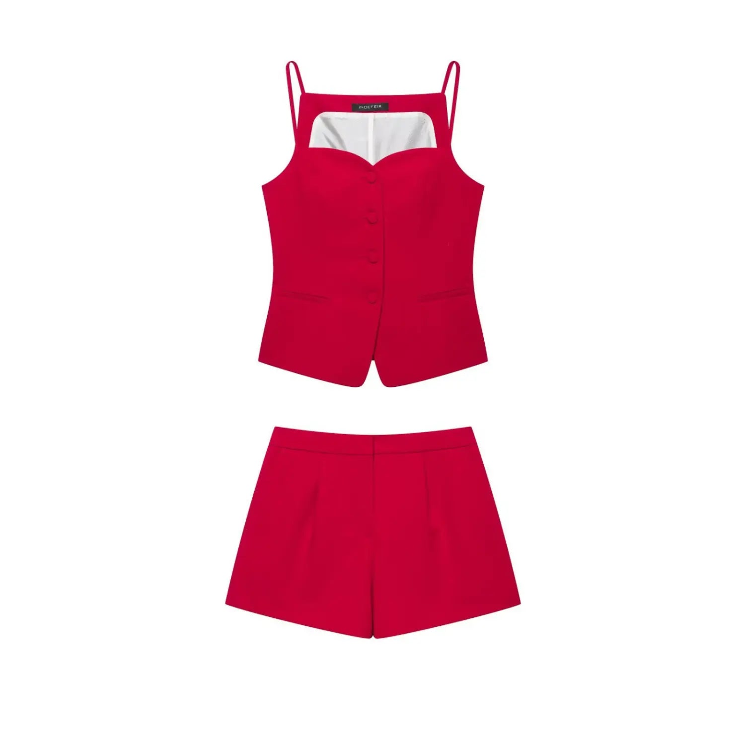 Full flat‑lay matching two‑piece set, red spaghetti strap cami top and high waist tailored suit shorts, white background