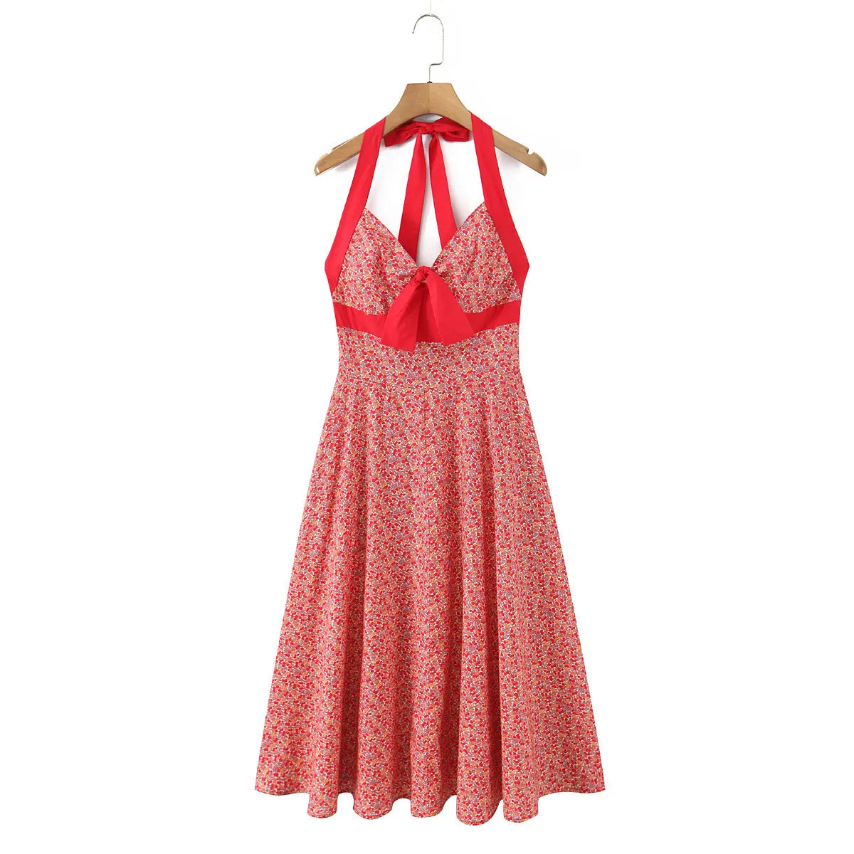 Full front view of halter maxi dress with red cherry & tiny floral print, solid red contrast trim and front bust bow detail.