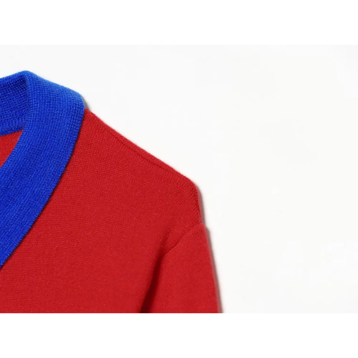 Shoulder and blue collar close-up of women red colorblock long sleeve knit polo shirt