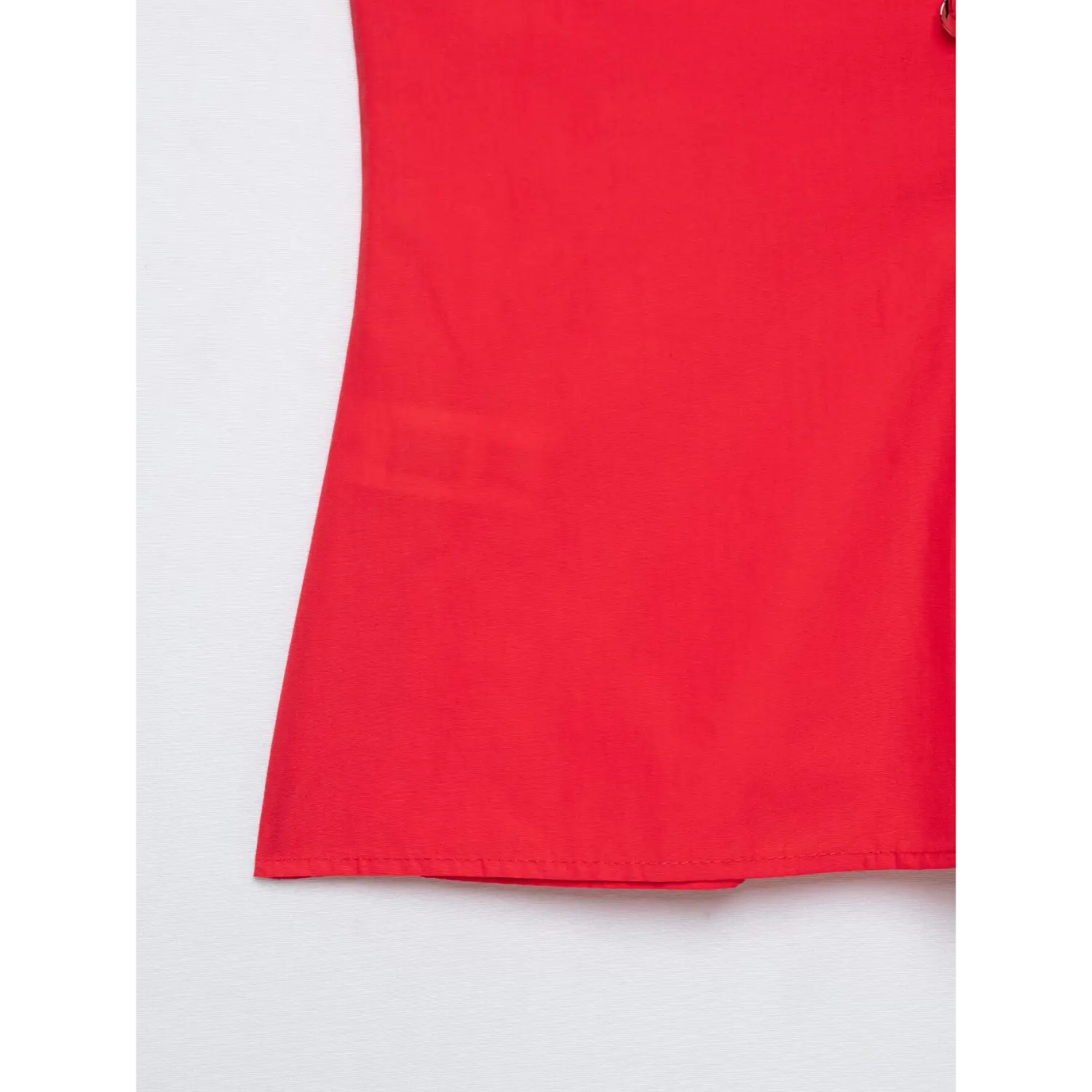 Close view of hem stitching on red fitted V-neck poplin top