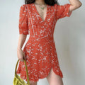 Lifestyle model photo, woman wearing red white floral V-neck chiffon mini dress