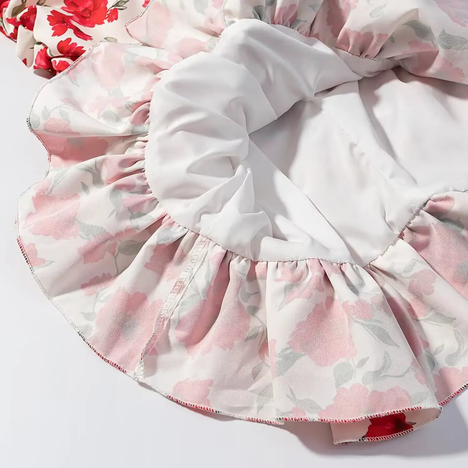 Ruffle hem and inner lining close-up of red floral bodycon mini dress