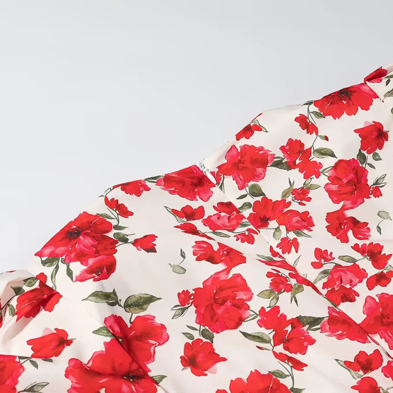 Allover red floral print fabric close-up, v-neck short sleeve mini dress