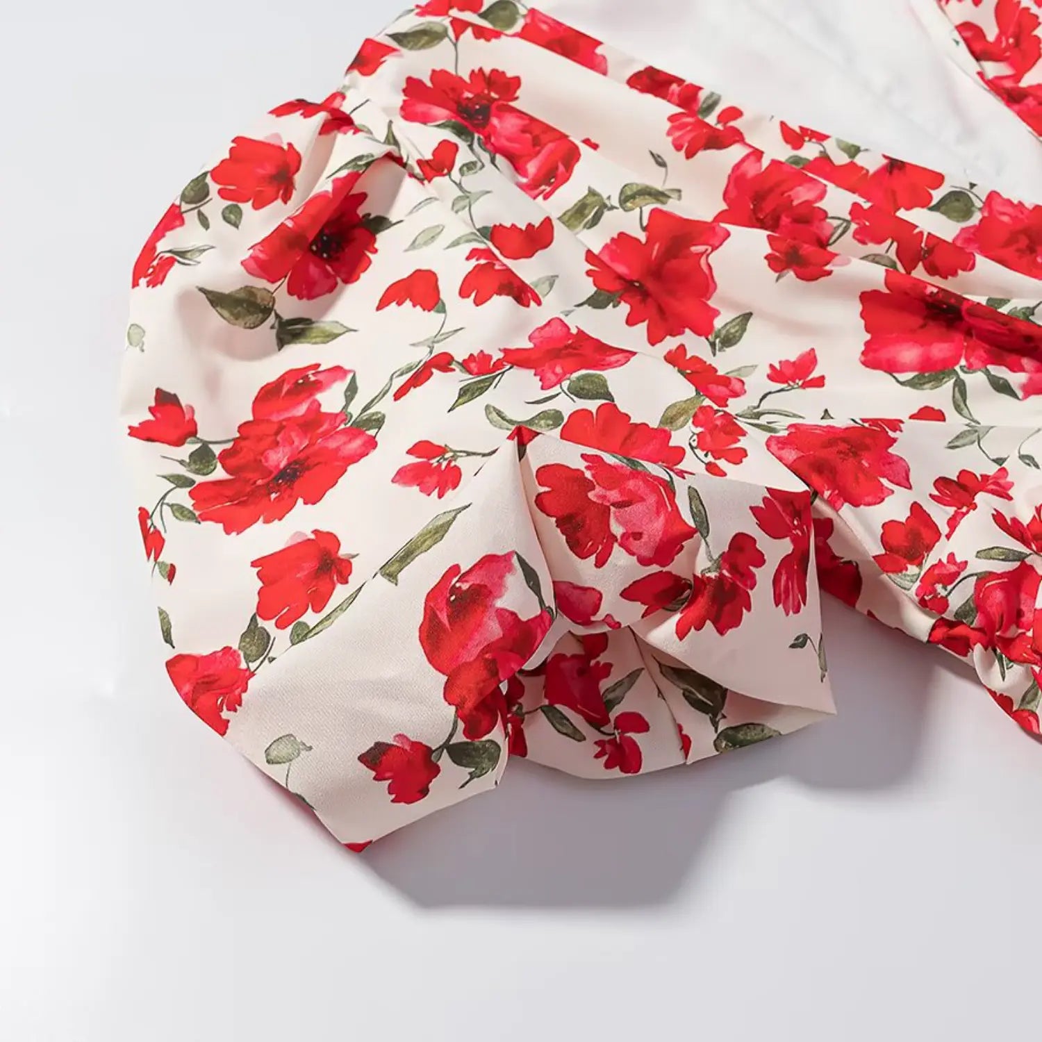 Puff sleeve fabric close-up, red floral satin mini dress texture detail