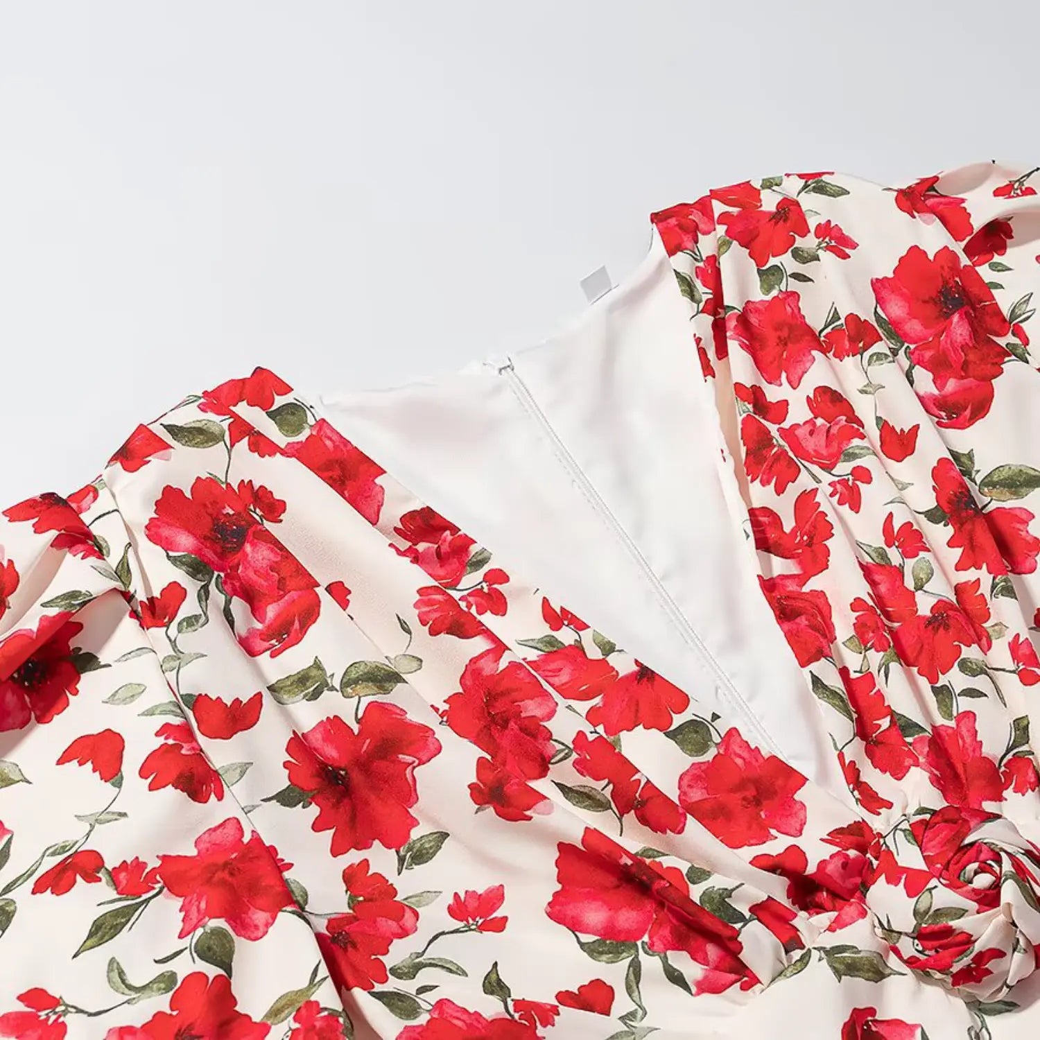 V-neck and back invisible zipper close-up of red floral summer mini dress