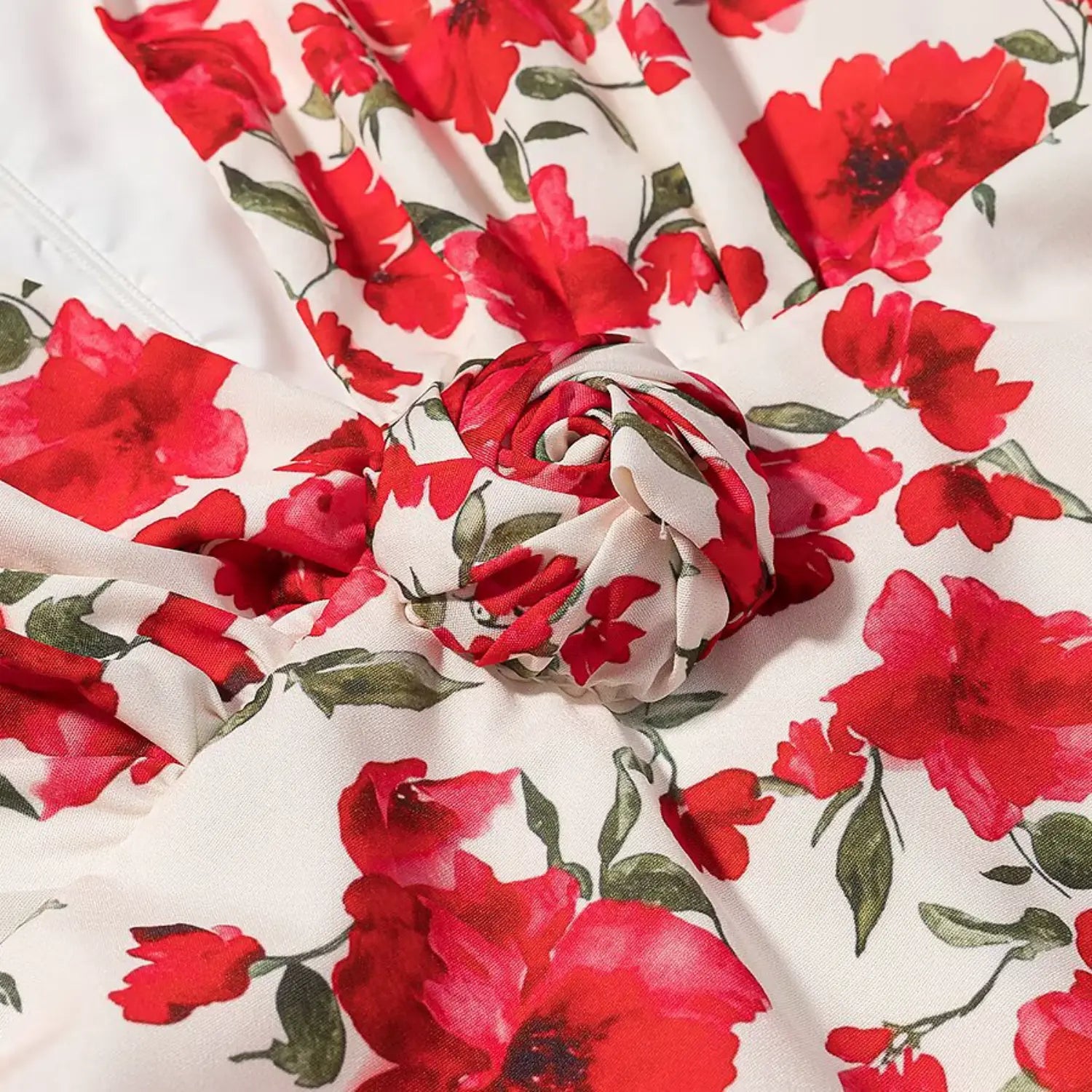 Waist knotted ruched detail close-up of red floral print v-neck bodycon mini dress