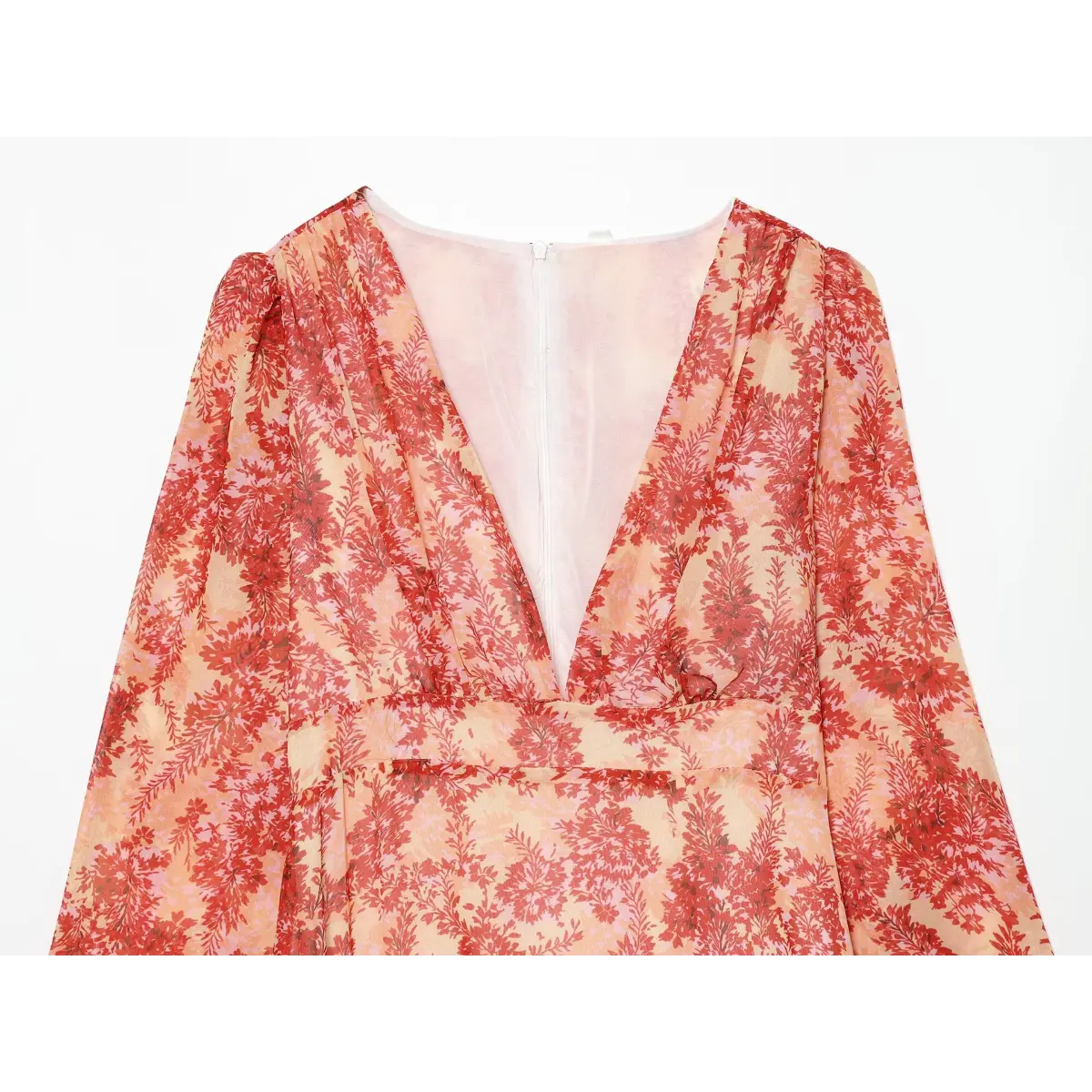 Close-up of the wrap-style front and V-neckline on the red floral dress