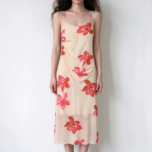 Female model front view wearing cream base red floral cami maxi dress, spaghetti strap, side ruched detail, sheer flowy long skirt