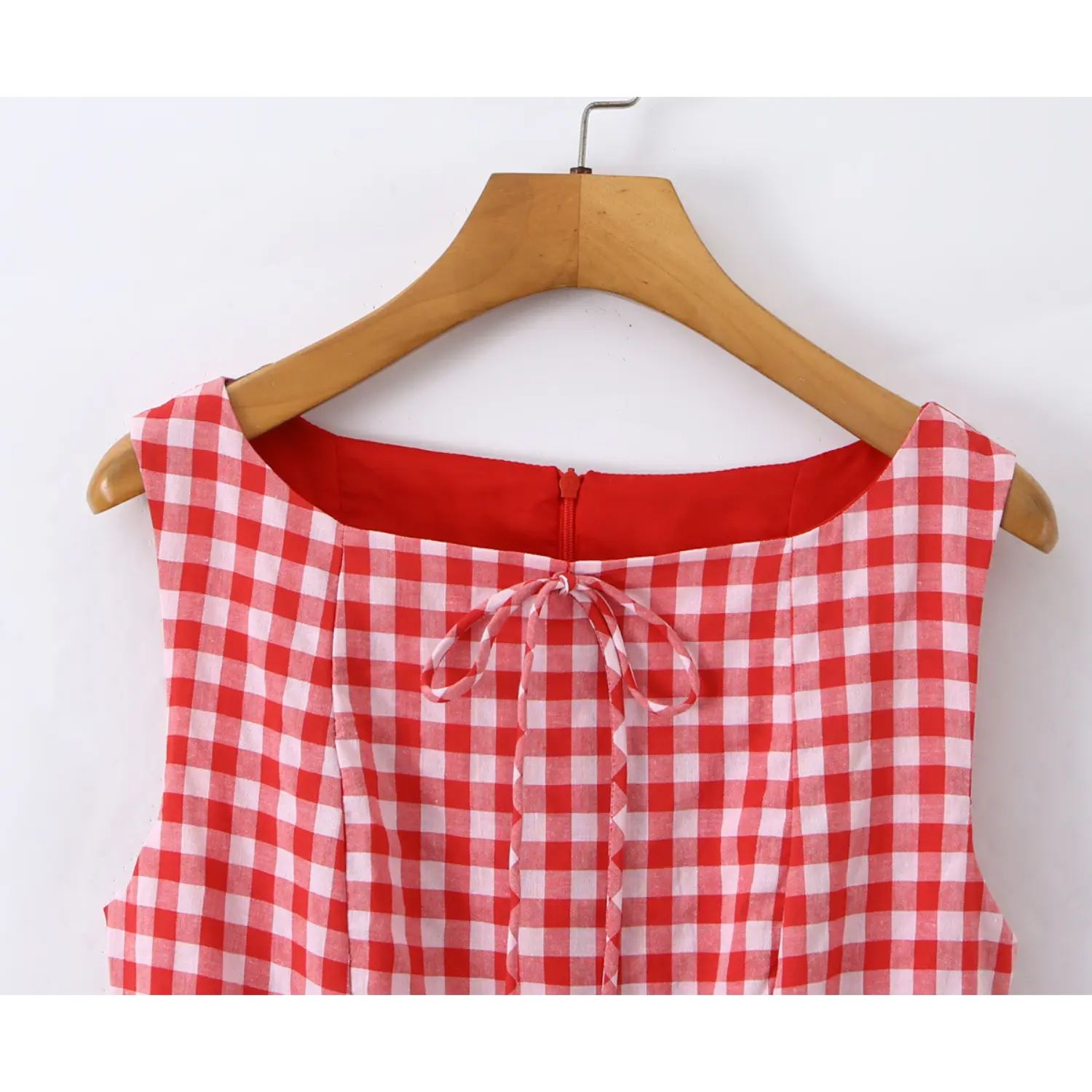 Close‑up square neck fabric tie bow and back zipper red gingham sleeveless mini dress