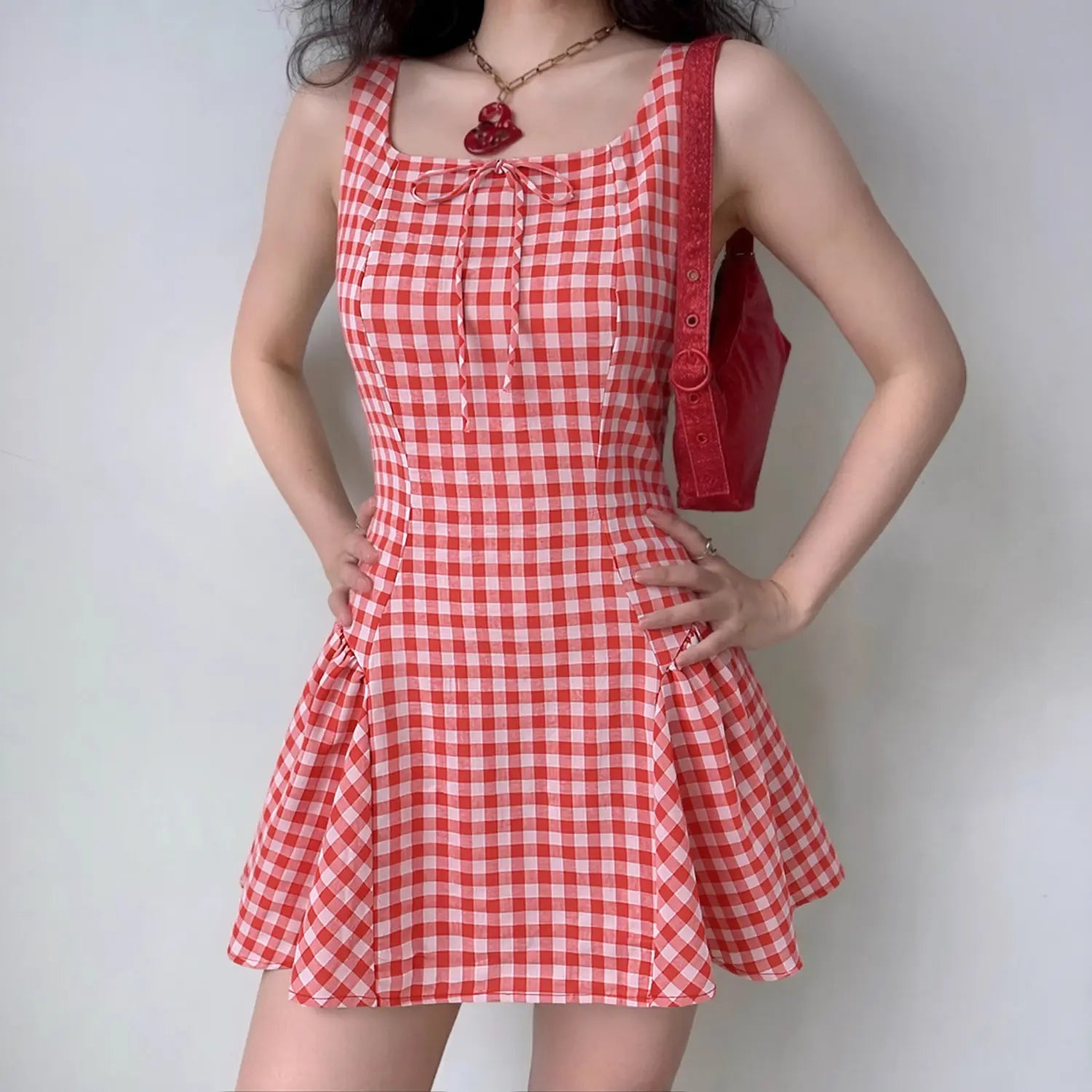 Model front wearing shot red gingham square neck tie front flared mini dress casual outfit