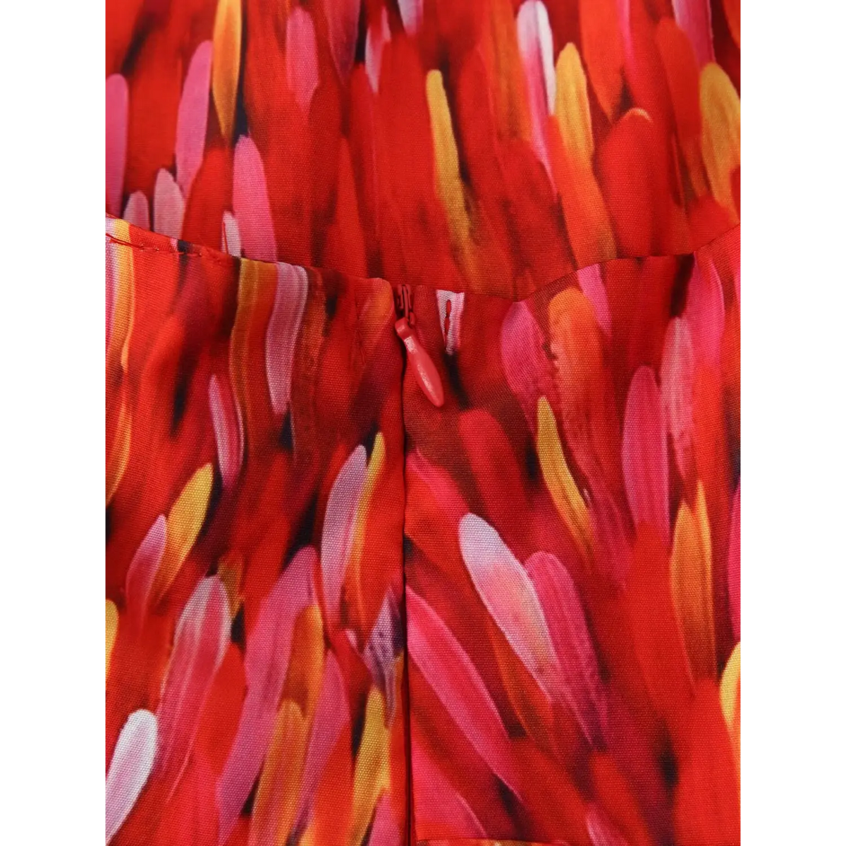 Extreme close‑up back invisible zipper pull red abstract brushstroke print halter maxi dress