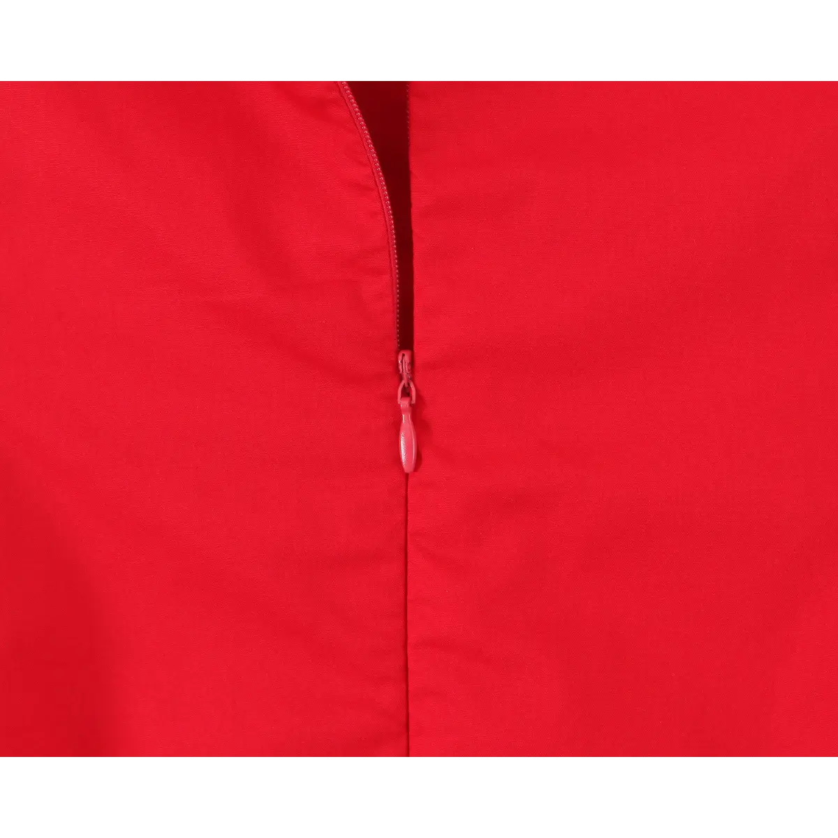 Close-up of the invisible side zipper on a bright red halter maxi dress, showing the matching red zipper pull.