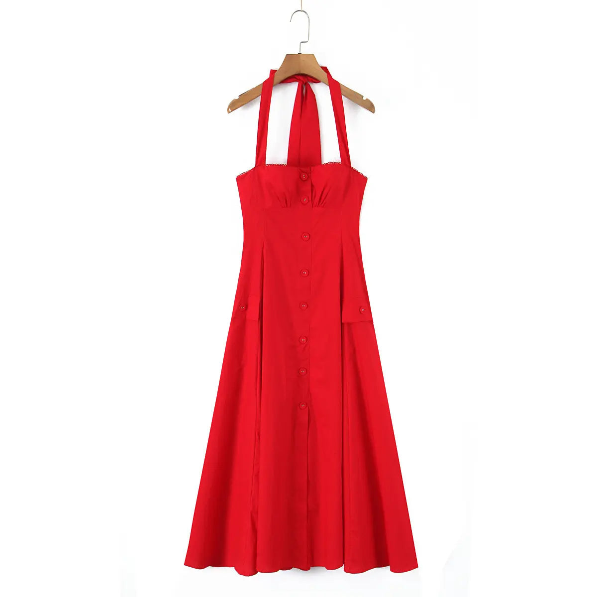 Bright red halter maxi dress hanging on a wooden hanger, showing the halter straps, button-down front, and flowing skirt.