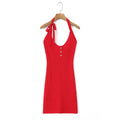 Full front white background product shot of cherry red openwork knit halter mini dress, U-neck, three shell buttons and self-fabric neck tie detail.