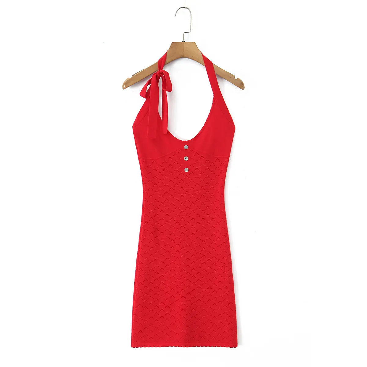 Full front white background product shot of cherry red openwork knit halter mini dress, U-neck, three shell buttons and self-fabric neck tie detail.