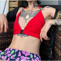 Model worn shot red deep v halter neck triangle crop top, cropped fit outdoor lifestyle view