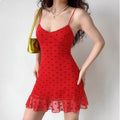 Lifestyle model shot women wearing red heart flocked mesh cami mini dress with shoulder bag