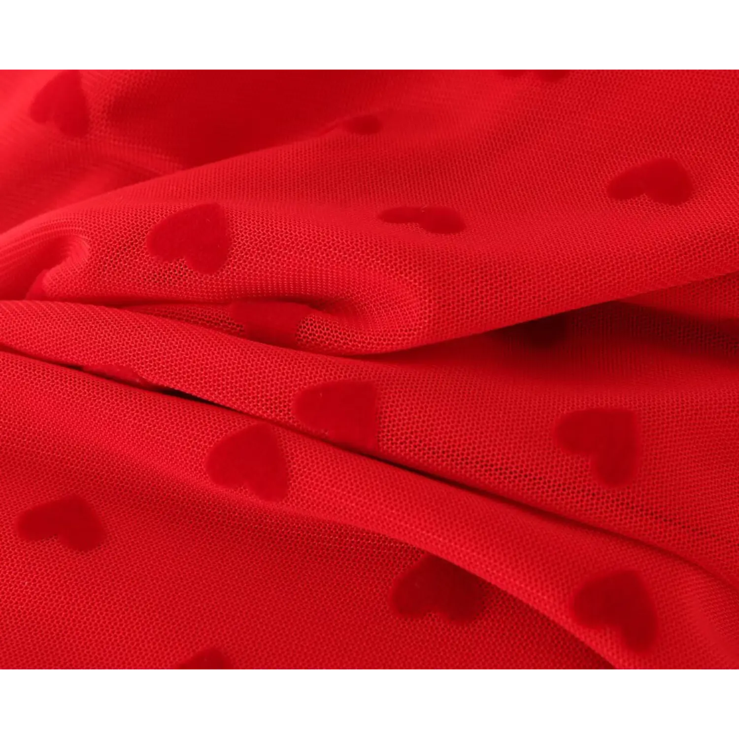 Macro close‑up fabric texture red mesh with velvet flocked heart print folded material