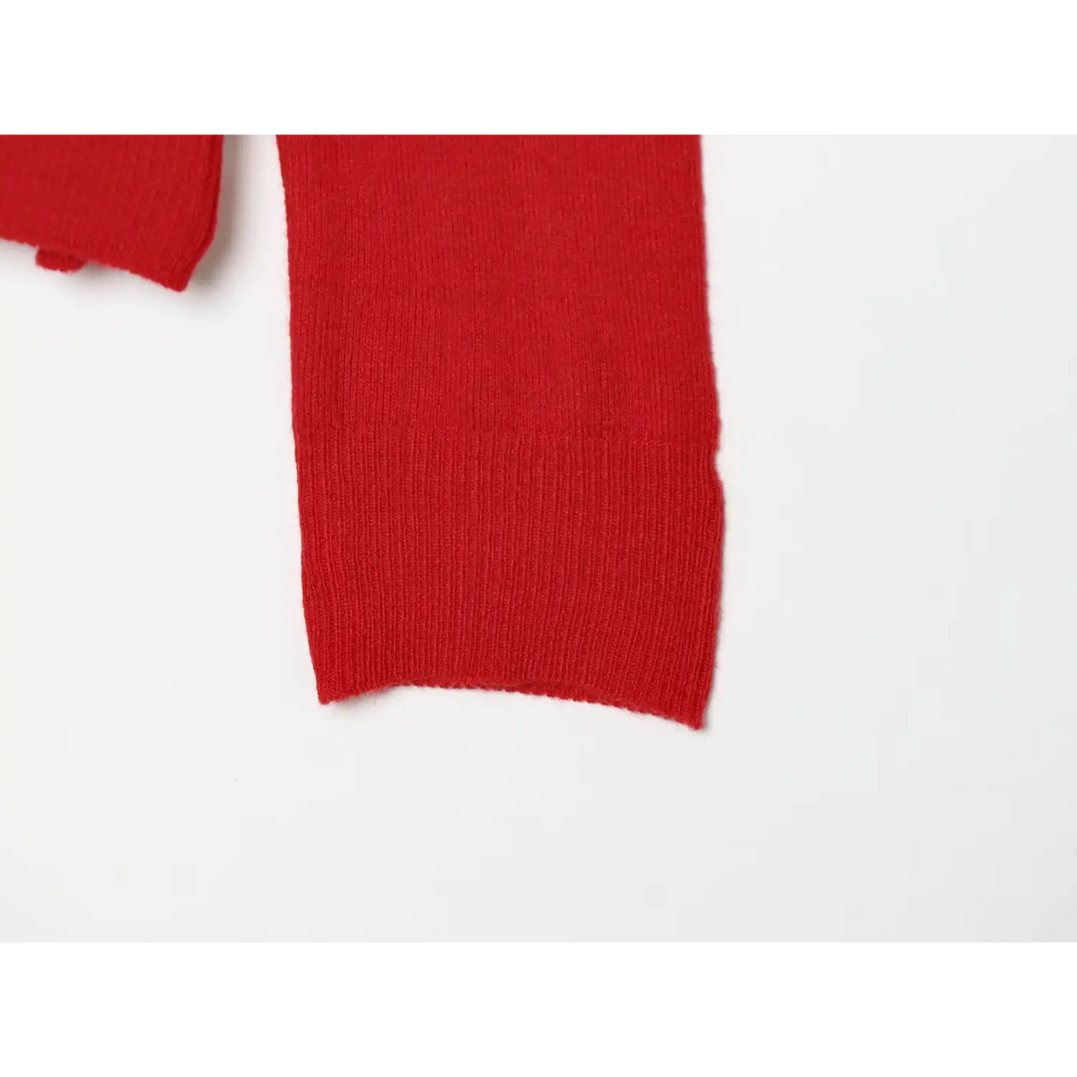 Close-up of ribbed sleeve cuff for women red colorblock knit polo sweater