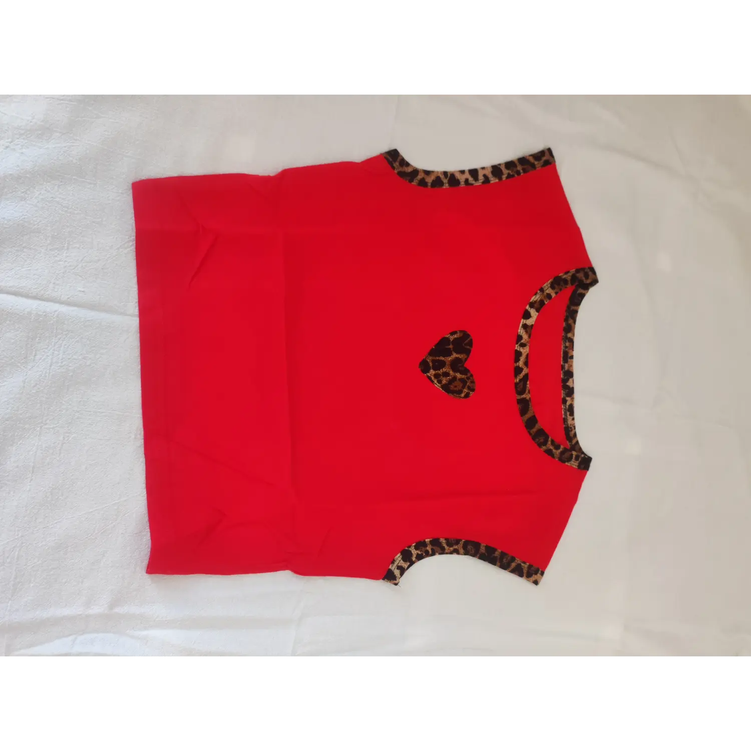 Red crop sleeveless tank top with leopard trim and leopard heart applique, front view