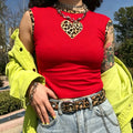 Outdoor model shot, y2k red cropped tank top with leopard print trim and heart patch