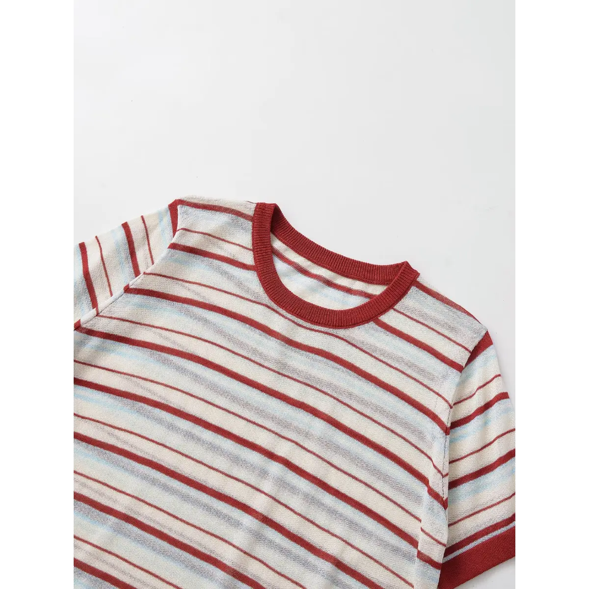 Front view of the red and light blue striped knit top, showing the crew neck, ribbed trim, and horizontal stripes