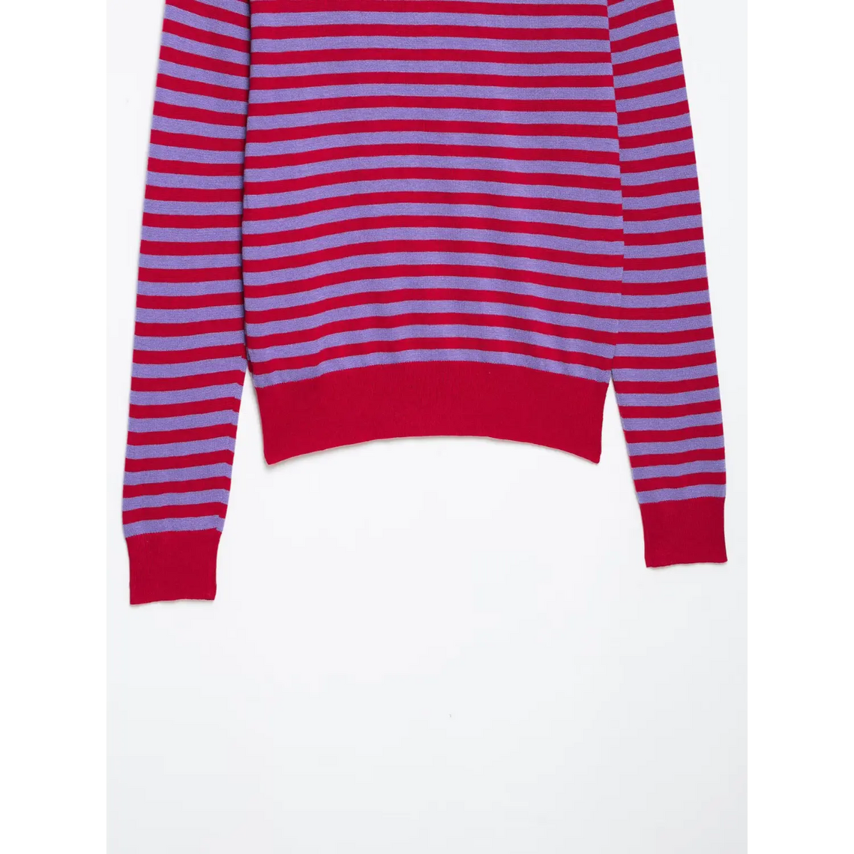 Close-up of red and lilac horizontal stripes with red ribbed cuff on knit top