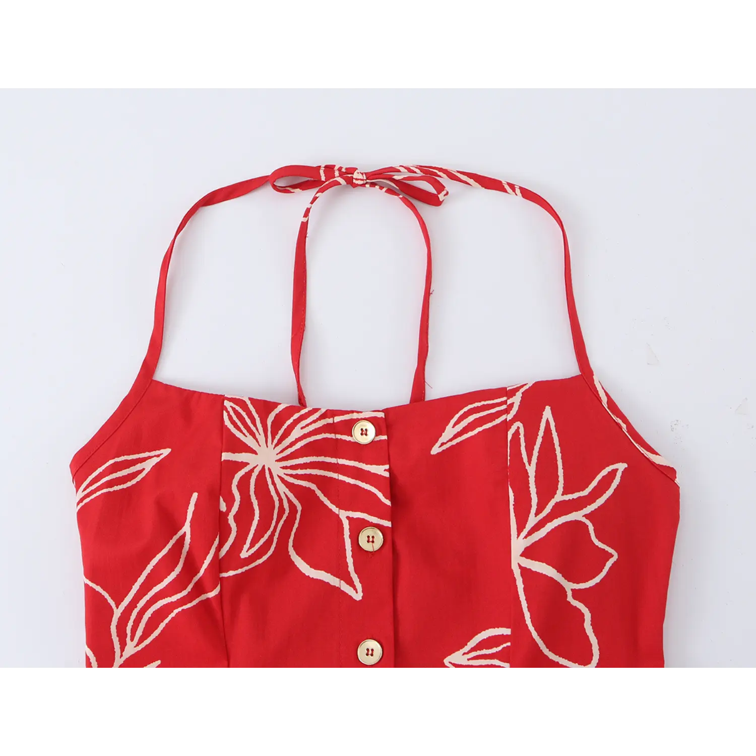 Close-up shot of halter tie neckline, front wooden buttons and line floral fabric texture