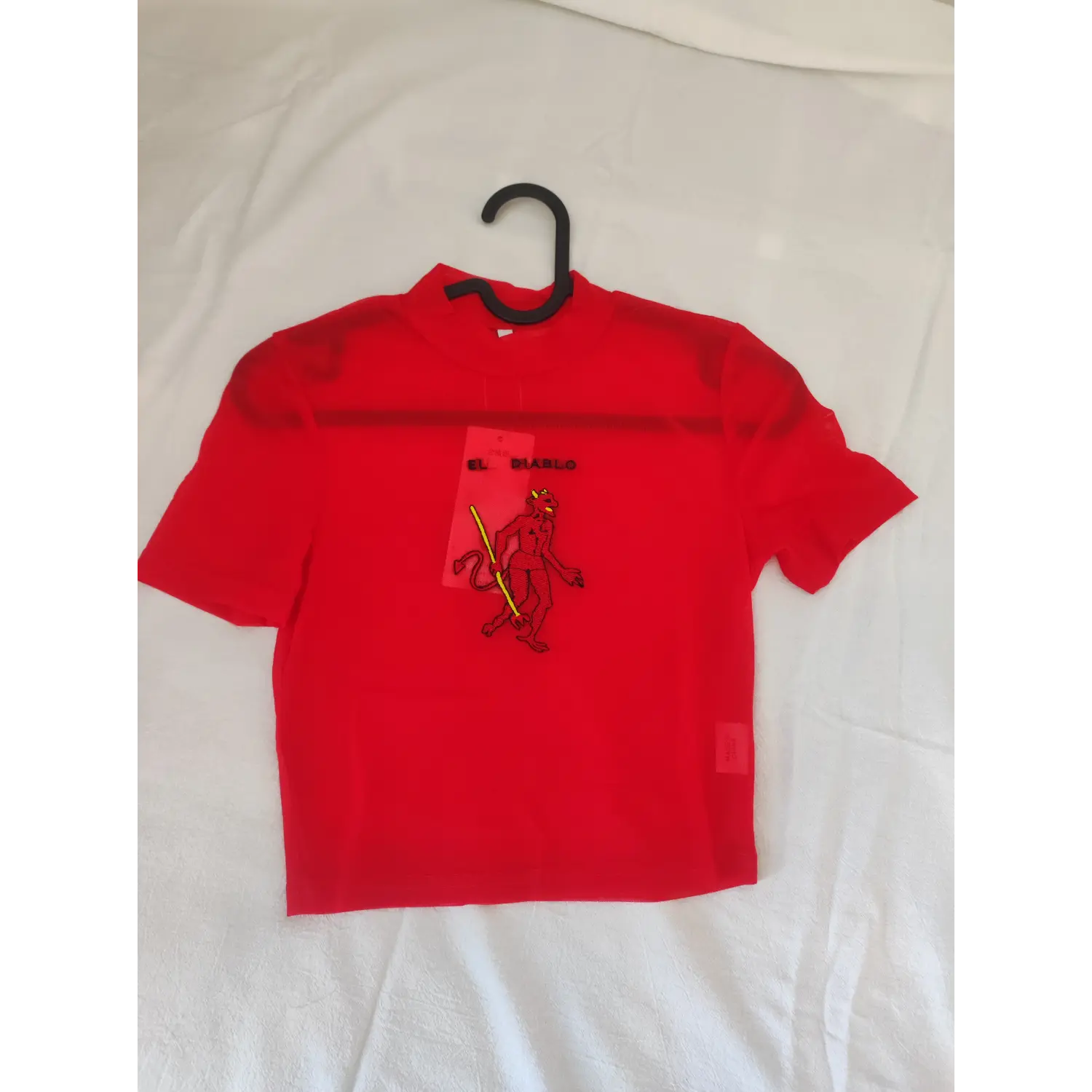 Flat lay front view, red sheer mesh mock neck crop short sleeve top with EL DIABLO devil embroidery