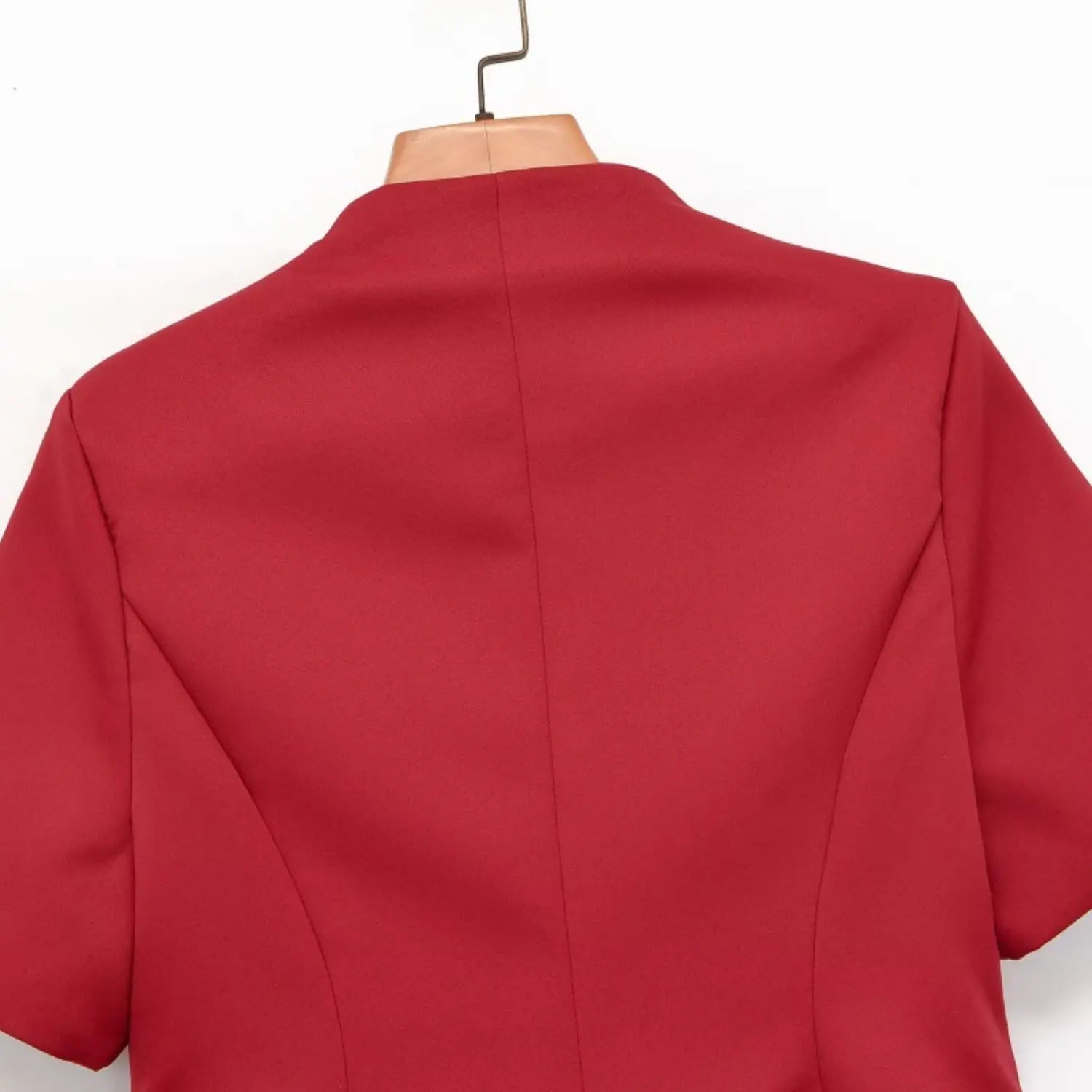 Back view red new chinese short sleeve blouse hanging on hanger, vertical center seam, fitted peplum silhouette
