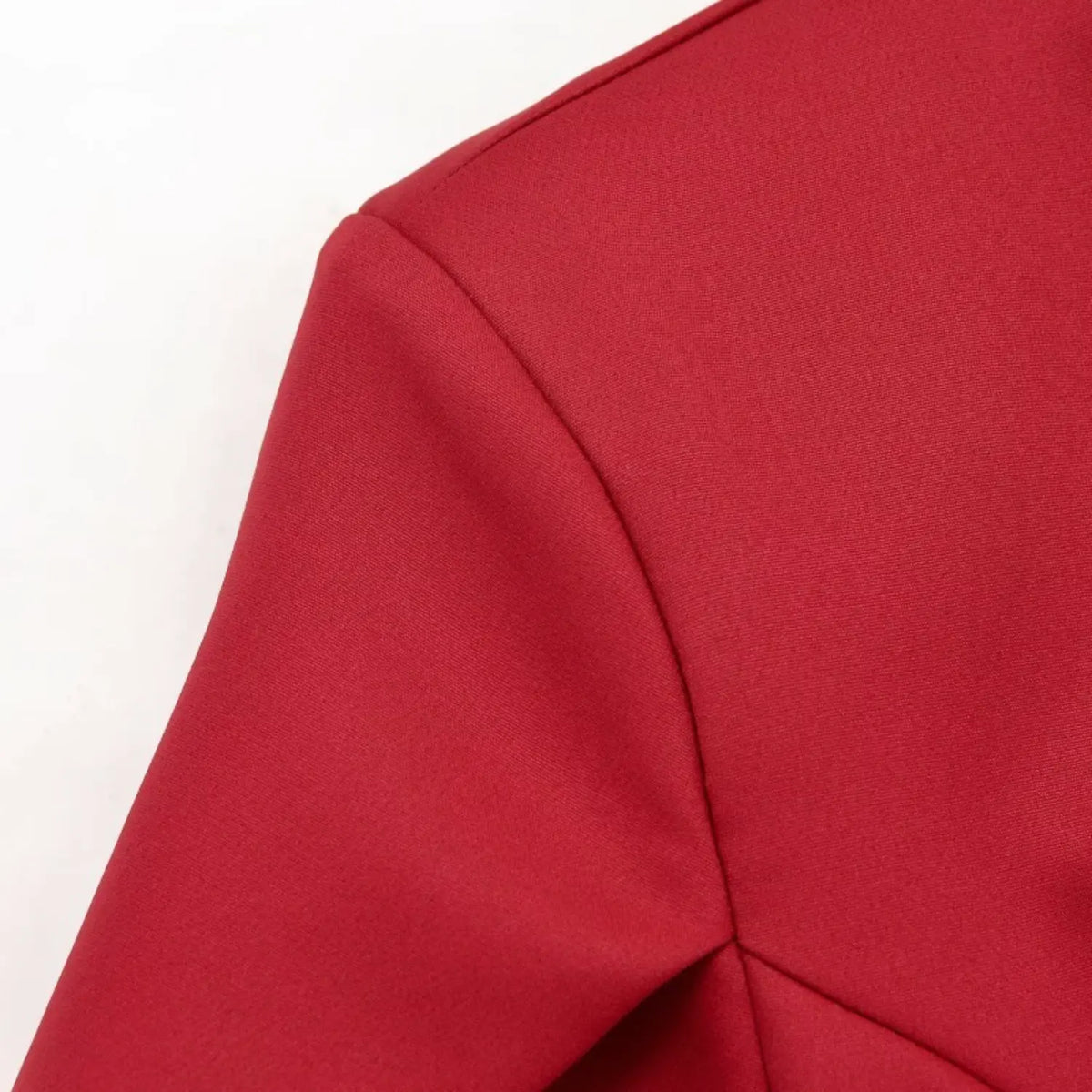Close-up shoulder seam detail of red new chinese blouse, tailored cutting and solid smooth fabric