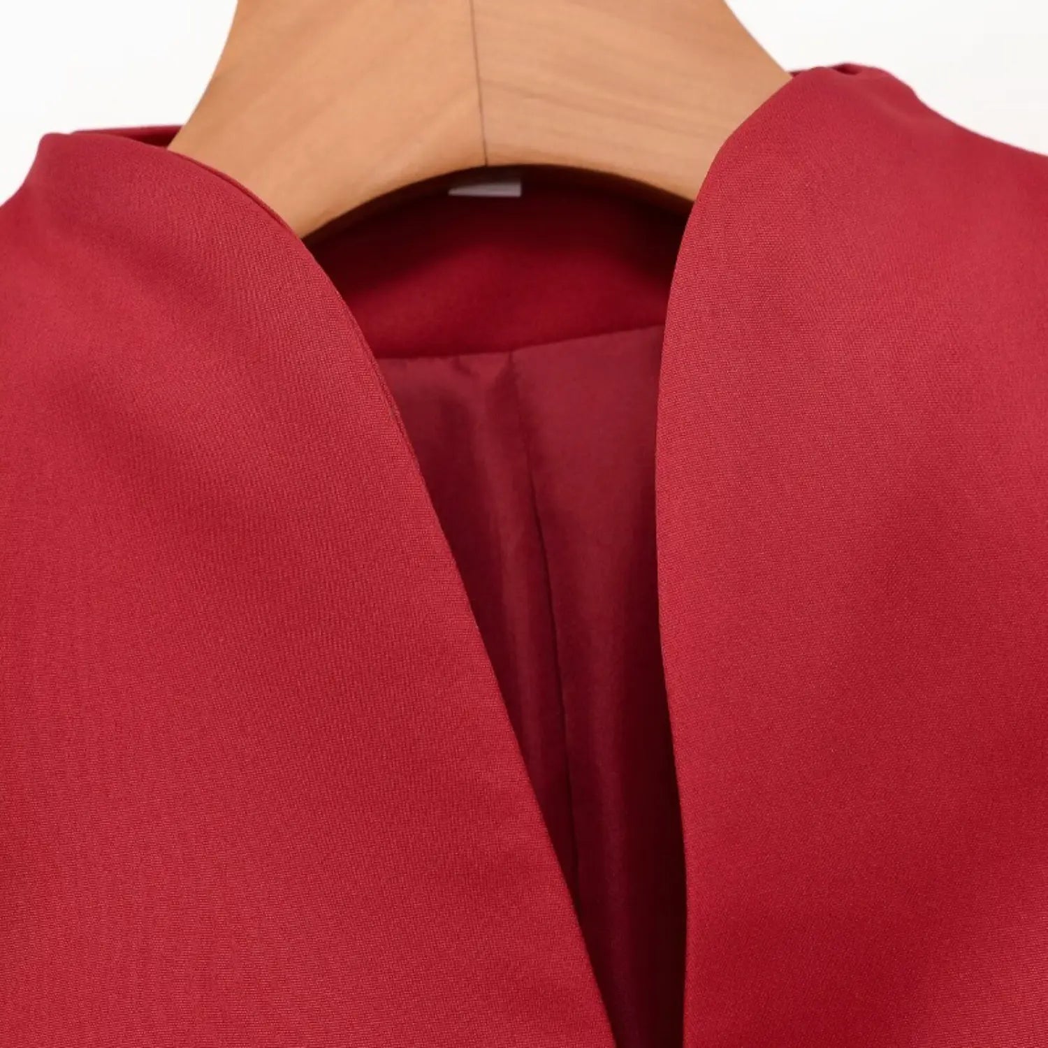 Close-up v neck collar shot of red new chinese short sleeve top, inner lining and clean neck stitching