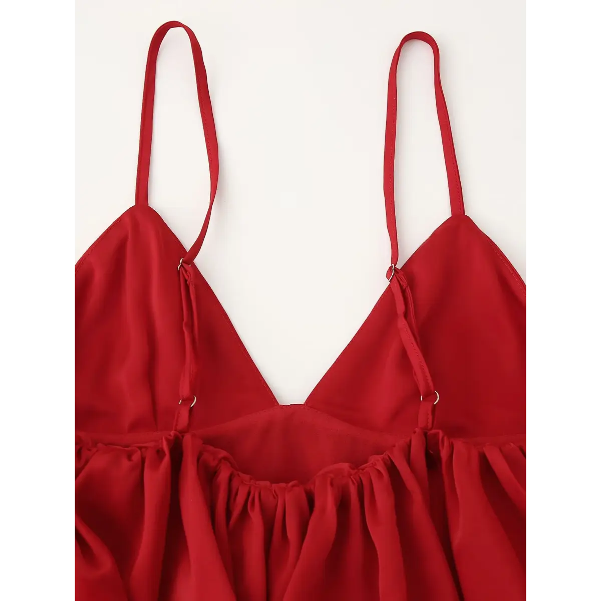 Back view of the red peplum cami top, showing the adjustable straps and gathered back panel