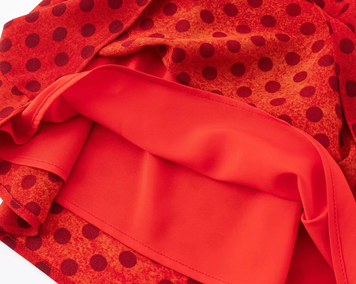 Close-up of the inner lining and layered fabric on the red polka dot halter dress