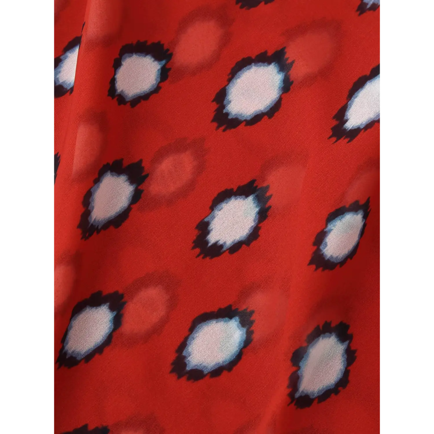 Red white polka dot print chiffon fabric texture closeup