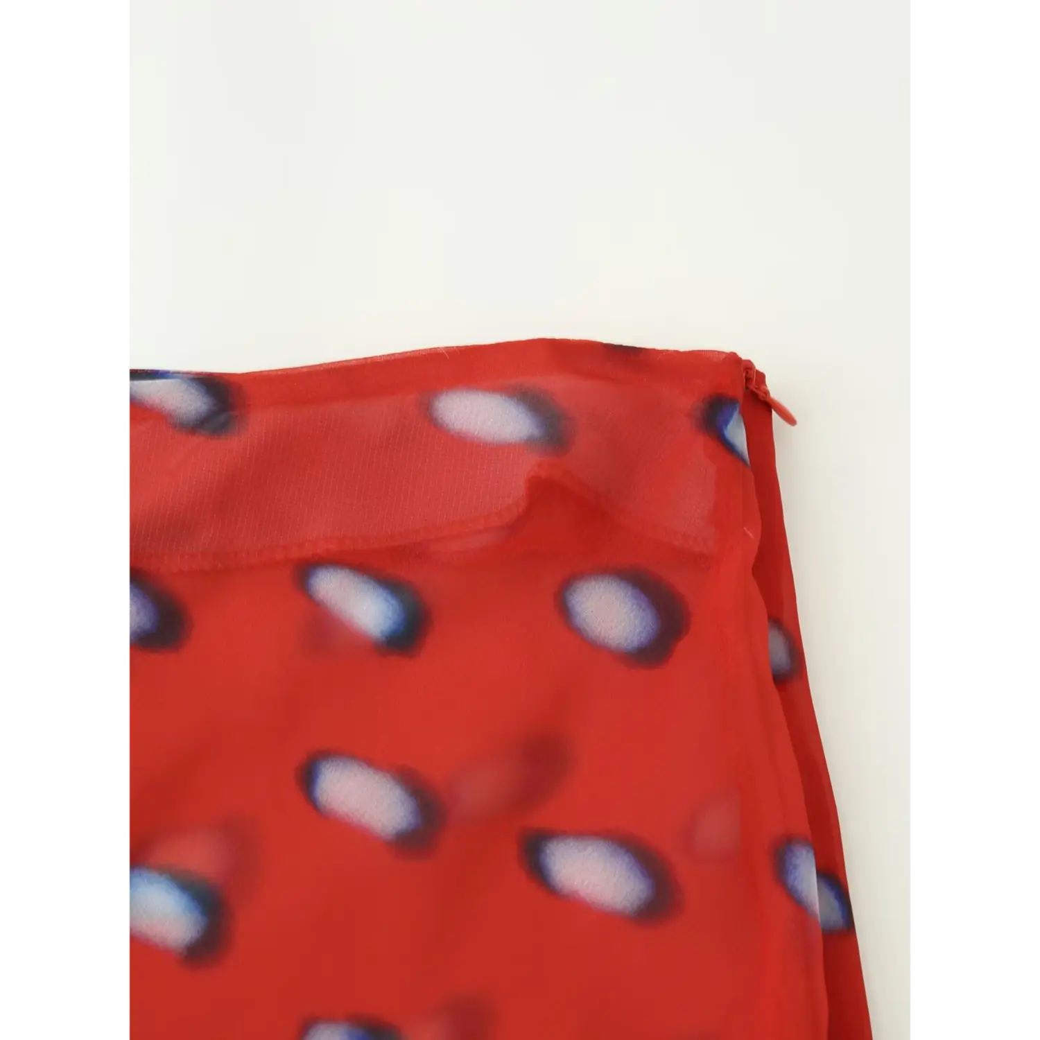 close shot waistband invisible side zipper red sheer blur dot wrap midi skirt waist seam fabric texture