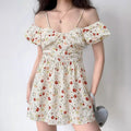 Model wearing a white poppy-print off-shoulder mini dress with puff sleeves and spaghetti straps.
