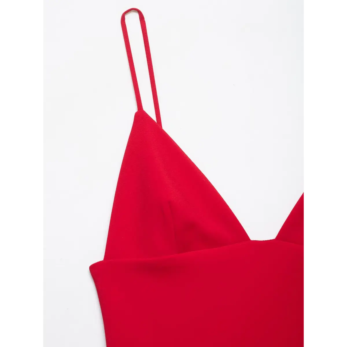 Close-up of the dress's double spaghetti strap, showing its construction and attachment point.
