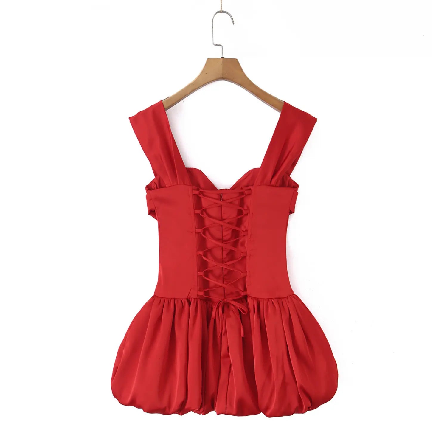 Full hanging shot of red satin corset mini dress with criss cross lace up back wide shoulder straps and bubble puff skirt hung on wooden hanger