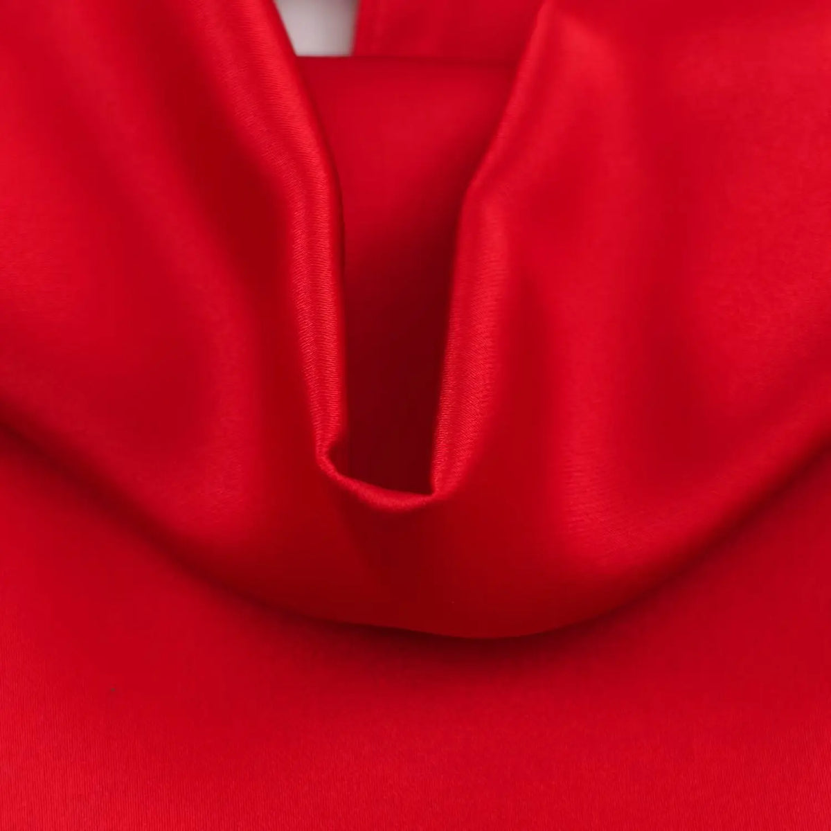 Close-up of inner cowl neckline on red satin dress